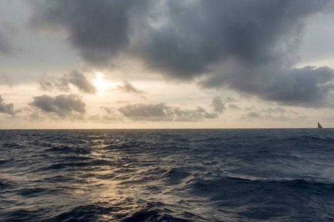 Onboard Team SCA – Three VO65s on the horizon at sunset - Leg six to Newport – Volvo Ocean Race 2015 © Corinna Halloran / Team SCA